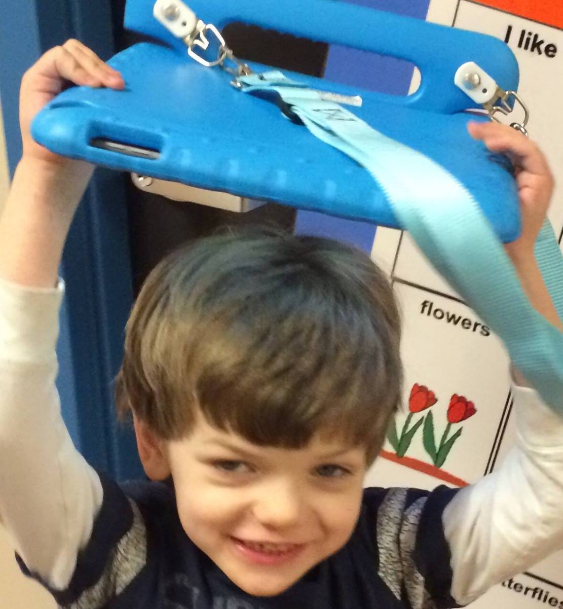 Luke with AAC device