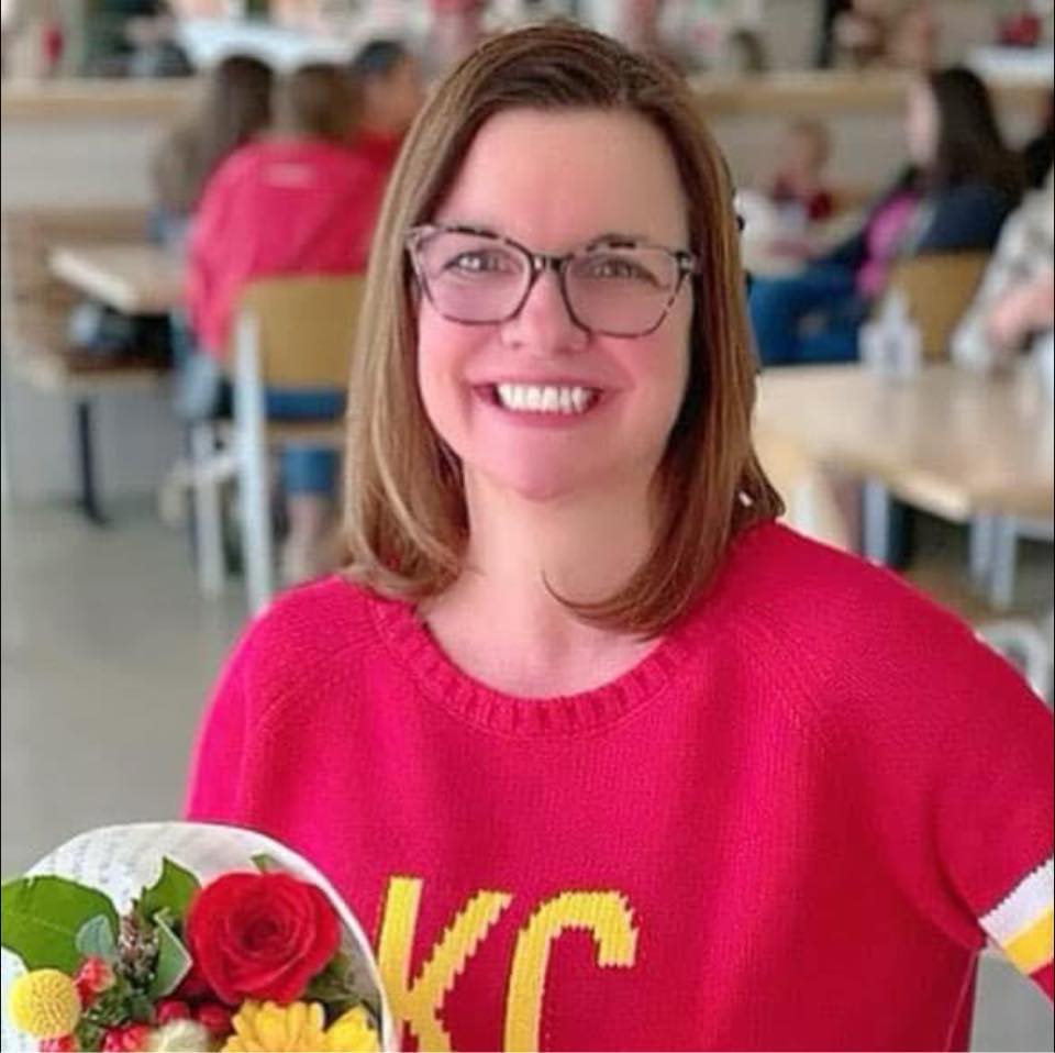 Woman holding a bouquet of flowers smiling